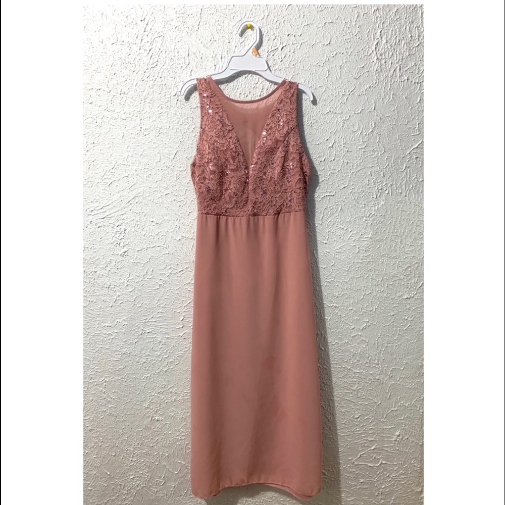 Baby pink dress. Dress has bra pads. Small stains.